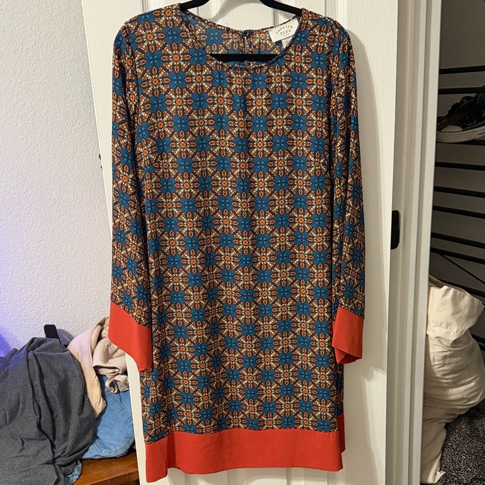 Geometric Patterned Dress with Orange Accents